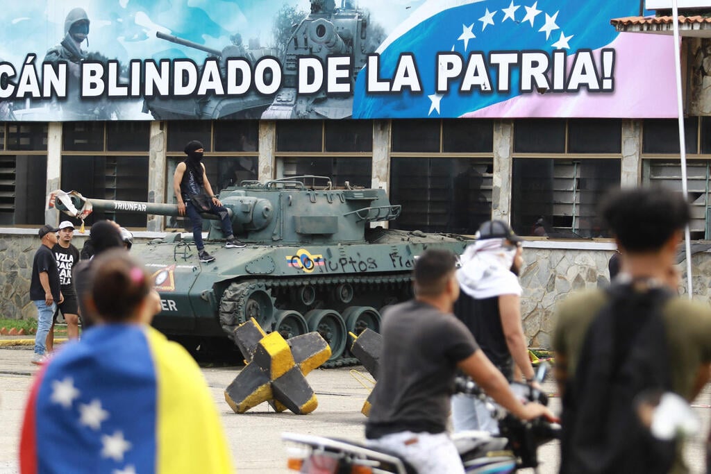 צילום: Juan Carlos HERNANDEZ / AFP מחאה בוונצואלה