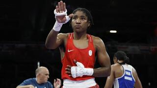 Boxer Cindy Ngamba secures historic first Olympic medal for refugee team at Paris 2024