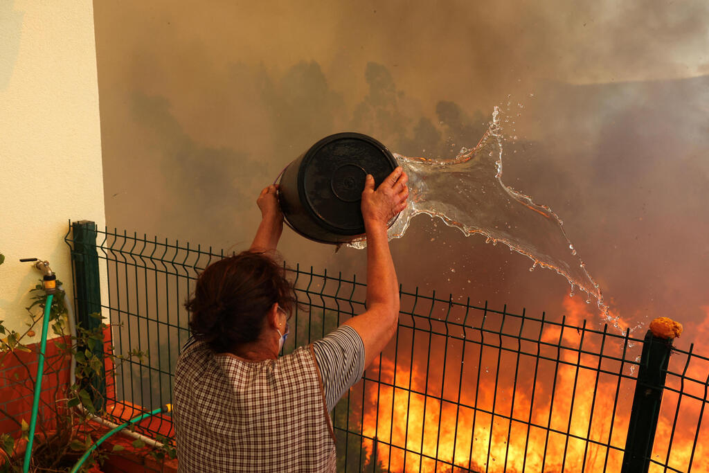 צילום: REUTERS/Pedro Nunes פורטוגל שריפה שריפות יער
