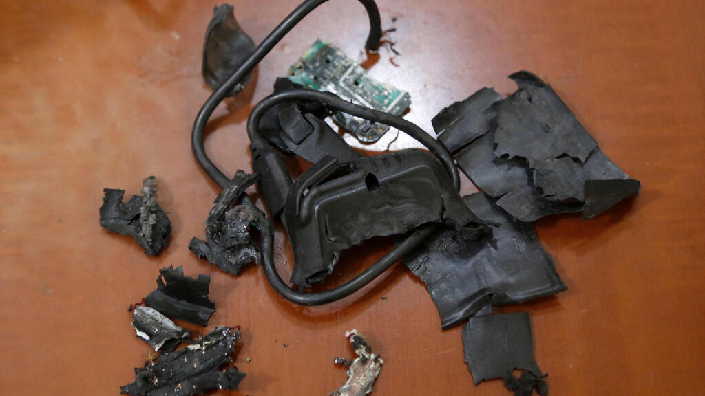Framgents of exploded pager (Photo: AFP) שרידי ביפר שהתפוצץ