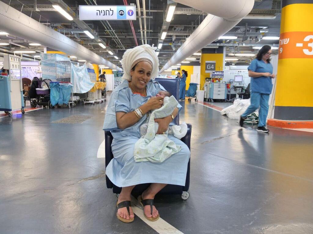 Einat Nissim and her 11th child (Photo: Rambam Health Care Campus) עינת ניסים יולדת רמב"ם בית חולים תת קרקעי