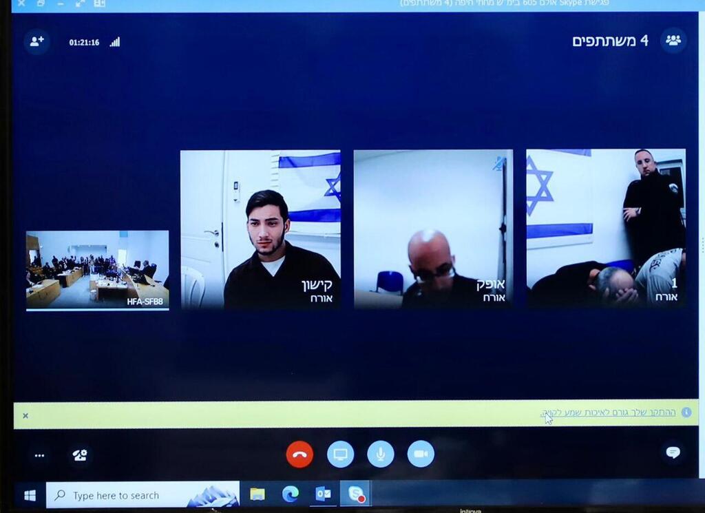 Suspected Iranian spy ring members brought before court via video link (Photo: Gil Nechushtan) הנאשמים בהעברת מידע לאיראן - אחד מהם הוא יגאל ניסן
