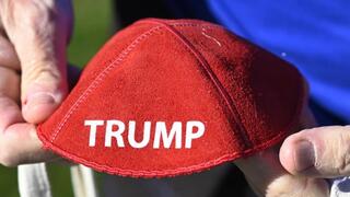 Republican Jewish Coalition member David Cuttner displays a yarmulke promoting Donald Trump 
