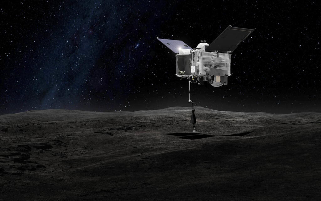 החללית מעל האסטרואיד (הדמיה: AP / NASA) החללית מעל האסטרואיד