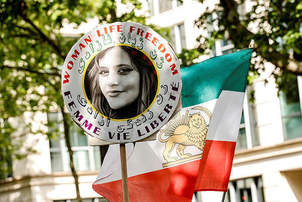 A demonstrator carries the portrait of Mahsa Amini, who died in detention following her arrest by the Iranian morality police in September 2022 (Photo: Teresa Suarez) A demonstrator carries the portrait of Mahsa Amini, who died in detention following her arrest by the Iranian morality police in September 2022