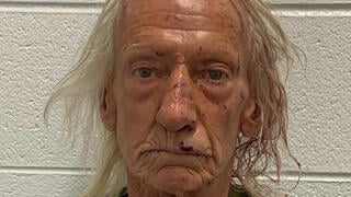Joseph M. Czuba poses for a police booking photograph after being arrested by the Will County Sheriff's Office in Illinois