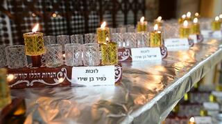 Erlau Yeshiva students light Hanukkah menorahs for hostages 