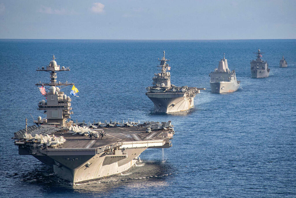 The USS Gerald R. Ford strike group (Photo: Maxwell Orlosky / US DEPARTMENT OF DEFENSE / AFP) נושאת המטוסים נושאת מטוסים ג'רלד פורד שטה עם ספינות מלחמה ספינה שמלוות אותה באזור הים התיכון ב-31 בדצמבר בצל ההחלטה האמריקנית להוציא אותה מהאזור ולהחזירה ל ארה"ב