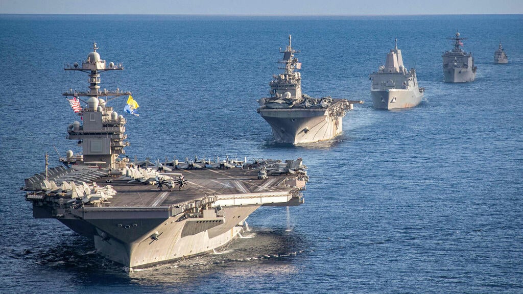 U.S. Navy ships (Photo: AFP) נושאת המטוסים נושאת מטוסים ג'רלד פורד שטה עם ספינות מלחמה ספינה שמלוות אותה באזור הים התיכון ב-31 בדצמבר בצל ההחלטה האמריקנית להוציא אותה מהאזור ולהחזירה ל ארה"ב
