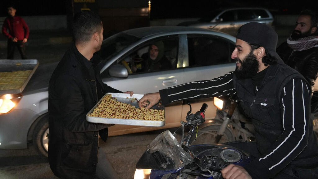 צילום: MUHAMMAD HAJ KADOUR / AFP חגיגות סוריה אדלב