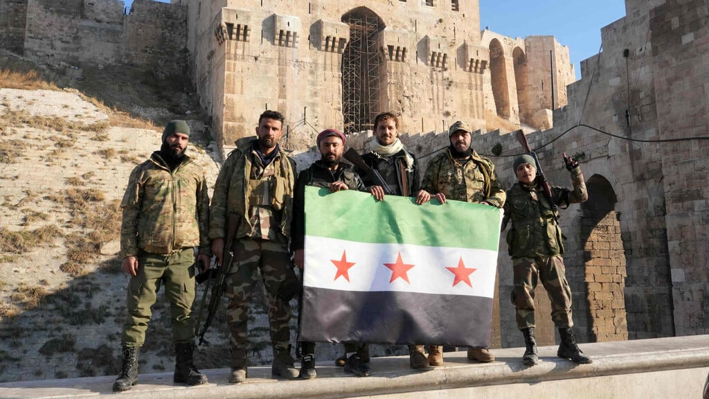 Insurgents in Aleppo (Photo: Muhammad Haj Kadour / AFP) חלב