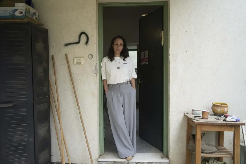Lishay Miran Lavi, whose husband of Omri Miran is held captive by Hamas in the Gaza Strip, poses for a portrait at the family’s home in Kibbutz Nahal Oz