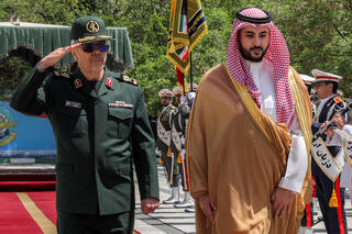 Iran's Armed Forces Chief of Staff Major-General Mohammed Bagheri (L) receiving Saudi Arabia's Defence Minister Prince Khalid bin Salman in Tehran 
