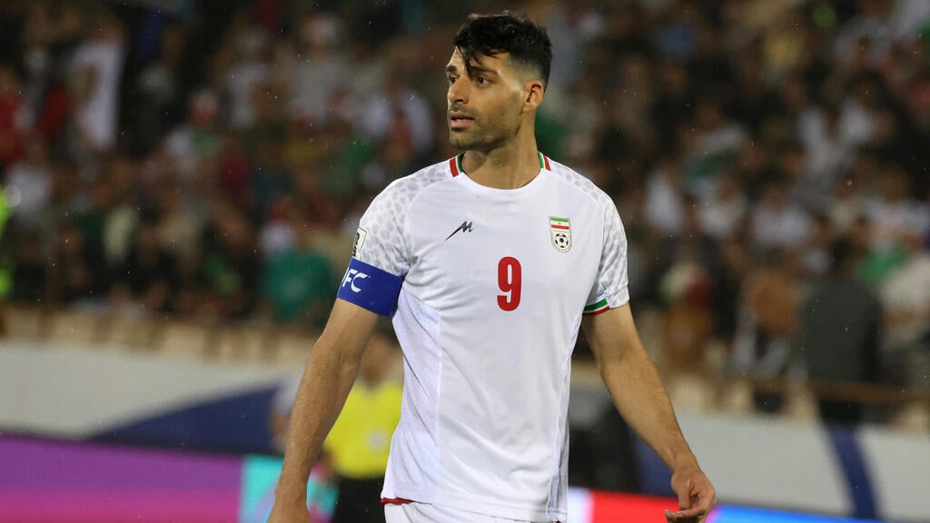 Iranian striker Mehdi Taremi may be barred from US and miss World Cup over ties to the Revolutionary Guards (Photo: Atta Kenare / AFP) שחקן נבחרת איראן מהדי טארמי