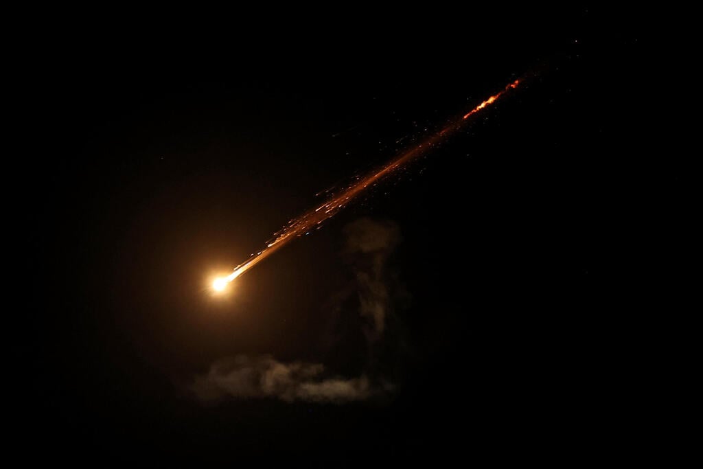 צילום: AHMAD GHARABLI / AFP יירוטים ברחבי הארץ בעקבות שיגורים מאיראן