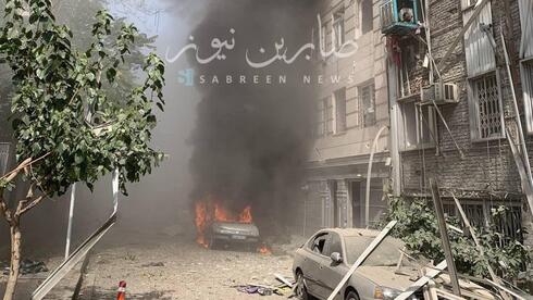 Multiple car bombs rock Tehran, Iranian reports say nuclear scientists killed