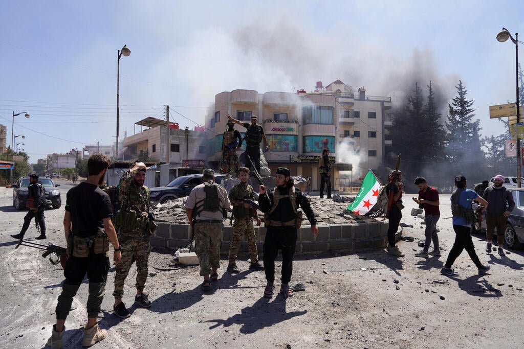 Photo: REUTERS/Karam al-Masri כוחות המשטר הסורי נכנסים למחוז א-סווידא ב סוריה