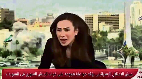 מגישת חדשות סורית בעת תקיפת צה"ל בדמשק yk14444720