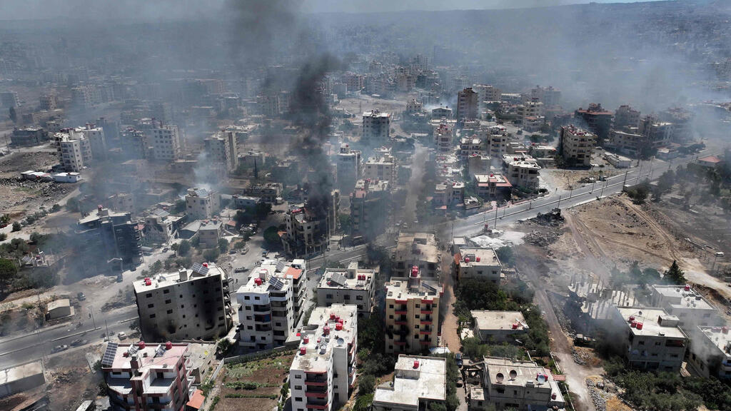 Smoke rising over Sweida amid clashes between Druze fighters and Syrian regime loyalists, last month (Photo: Omar Haj Kadour/ AFP) לחימה קרבות ב א-סווידא סווידא מעוז הדרוזים דרוזים ב סוריה