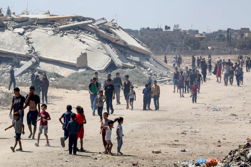 Photo: Eyad BABA / AFP הצנחת סיוע הומניטרי בעזה