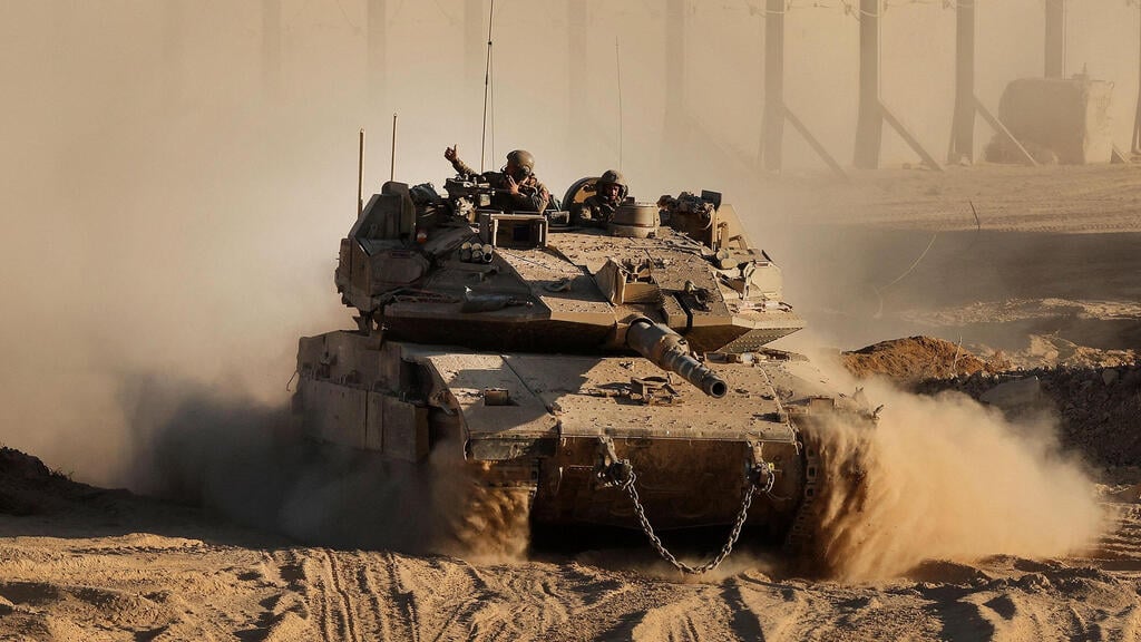 טנק ברצועת עזה, ארכיון (צילום: Jack GUEZ / AFP) כוחות צה"ל בגבול רצועת עזה