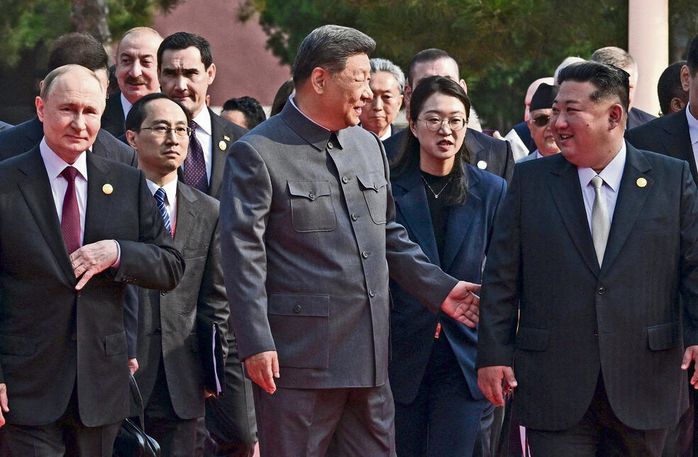 מנהיגי העולם הלא־חופשי — קים, שי ופוטין | צילום: רויטרס yk14500527