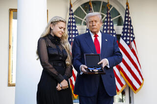 U.S. President Donald Trump posthumously awards the Presidential Medal of Freedom to late conservative activist Charlie Kirk as he presents the Medal to his wife Erika Kirk during a ceremony in the Rose Garden of the White House