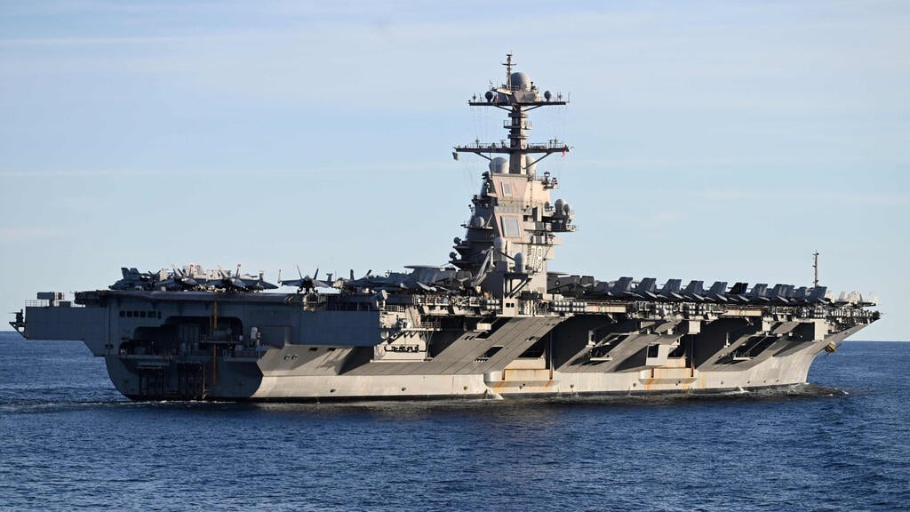the aircraft carrier USS Gerald R. Ford (Photo: Jonathan KLEIN / AFP) נושאת המטוסים האמריקנית "ג'רלד פורד" במהלך תרגיל של נאט"ו
