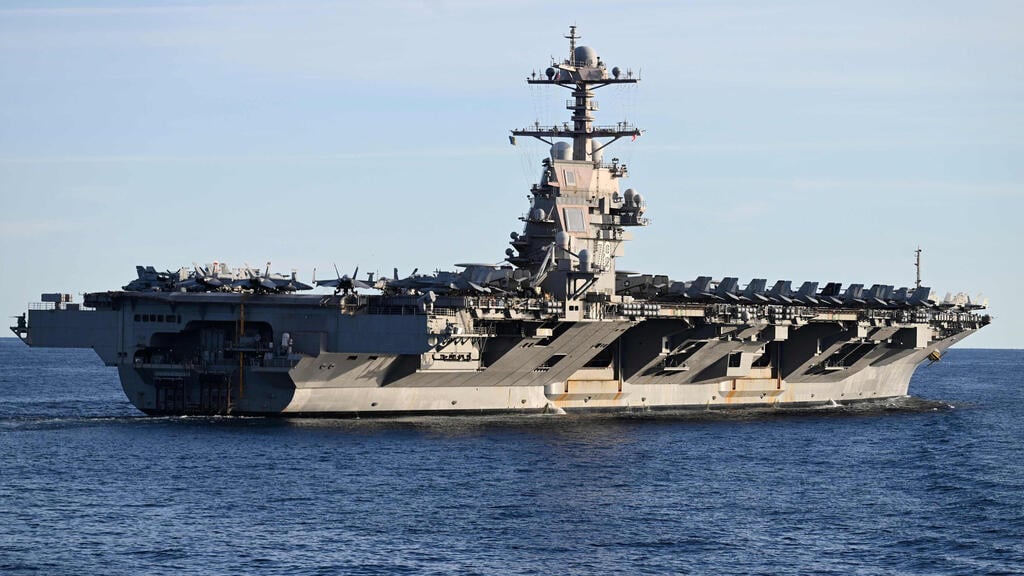 The US aircraft carrier Gerald Ford, which was moved from the Middle East to the Caribbean in November (Photo: Jonathan Klein/ AFP) נושאת המטוסים האמריקנית "ג'רלד פורד" במהלך תרגיל של נאט"ו