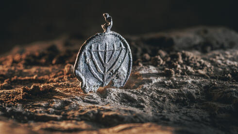 Rare menorah pendant found in Jerusalem