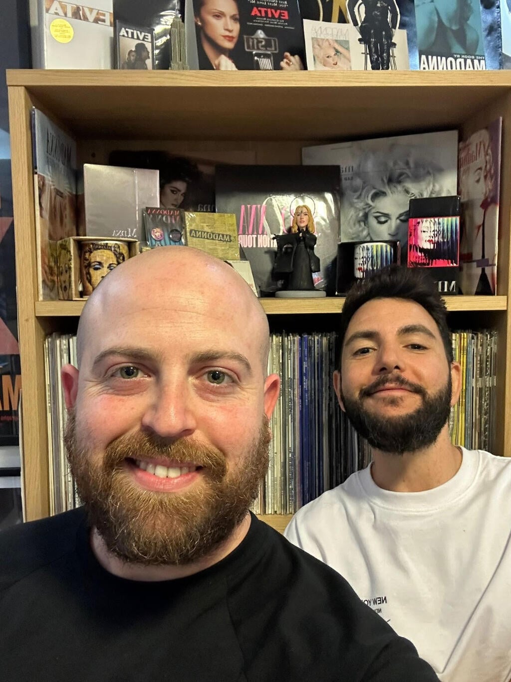 People & Collectors podcast host Bar Gindy, left, poses with Madonna collector Avihay at Avihay’s home, surrounded by his extensive Madonna archive of records, CDs and memorabilia 