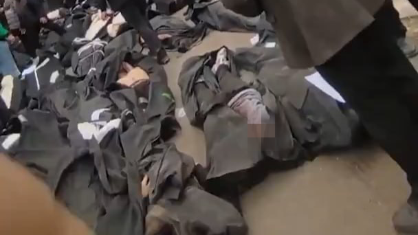 Body bags in Iran during the current protests; a human toll far heavier than can ever be counted with precision עשרות גופות של מפגינים בעיר קחריזאק באיראן, וקרובי ההרוגים מתייפחים לידם