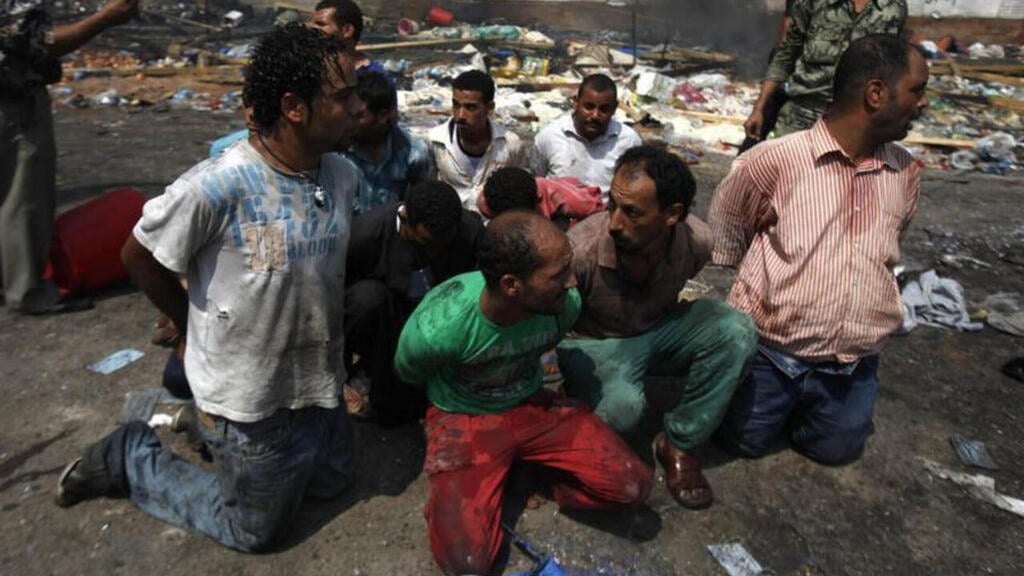 Detainees during the protest at Rabaa al-Adawiya Square in Cairo, Egypt, 2013 (Photo: Reuters) עצורים ב מחאה ב כיכר ראבעה אל-עדוויה ב קהיר, מצרים, 2013