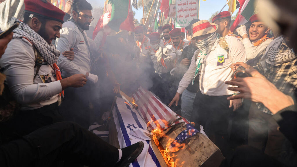 Photo: AHMAD AL-RUBAYE / AFP הפגנת תומכי משטר האייתולות בבגדד