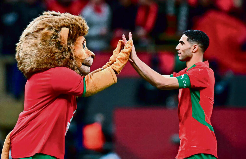 חכימי והקמע של האליפות. מצטיין היבשת (PAUL ELLIS, AFP) חכימי והקמע של האליפות. מצטיין היבשת