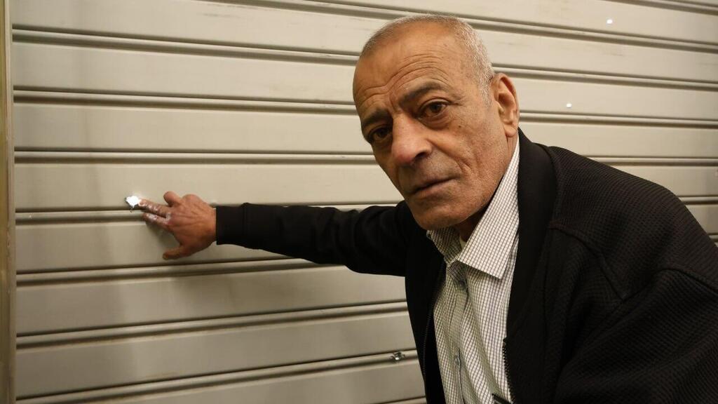 “More than 200 bullets were fired at my store,” Ali Zbeidat said. (Photo: Elad Gershgoren) עלי זבידאת, בעל עסק שנאלץ לסגור בגלל פרוטקשן