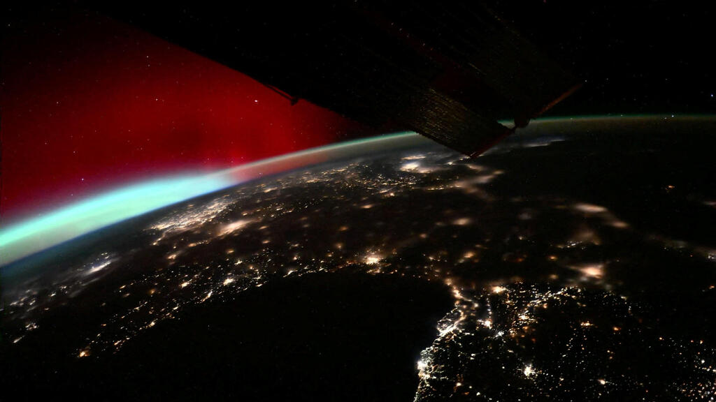 הזוהר הצפוני השבוע מהחלל (צילום: Roscosmos/Sergey Kud-Sverchkov/Handout via REUTERS) הזוהר הצפוני השבוע מהחלל