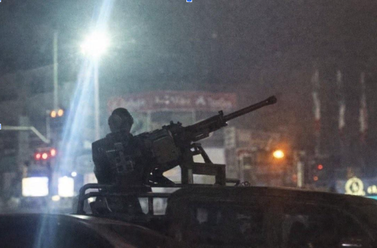 A regime agent is seen manning a machine gun during widespread street protests (Screenshot: Social media) A regime agent is seen manning a machine gun during widespread street protests