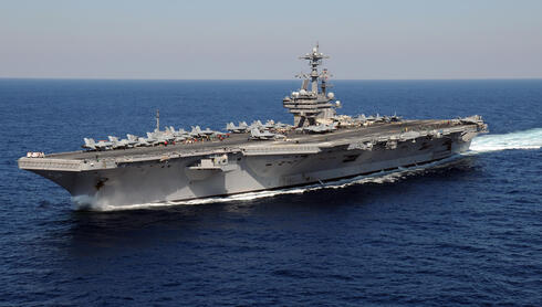 Third US aircraft carrier heads to region as Trump signals long war