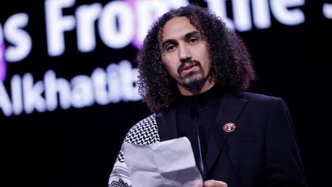 Director Abdallah Alkhatib accepts the GWFF Best Feature Film Debut Award for 'Chronicles From the Siege' 