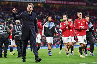 מייקל קאריק ושחקני מנצ'סטר יונייטד. הזכיר להם מה זה ללבוש את המדים האדומים