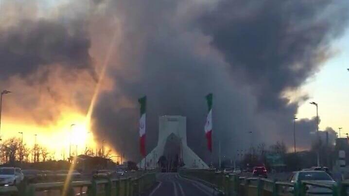 Smoke rises from Azadi Square in Tehran after an air strike כיכר אזאדי בטהרן