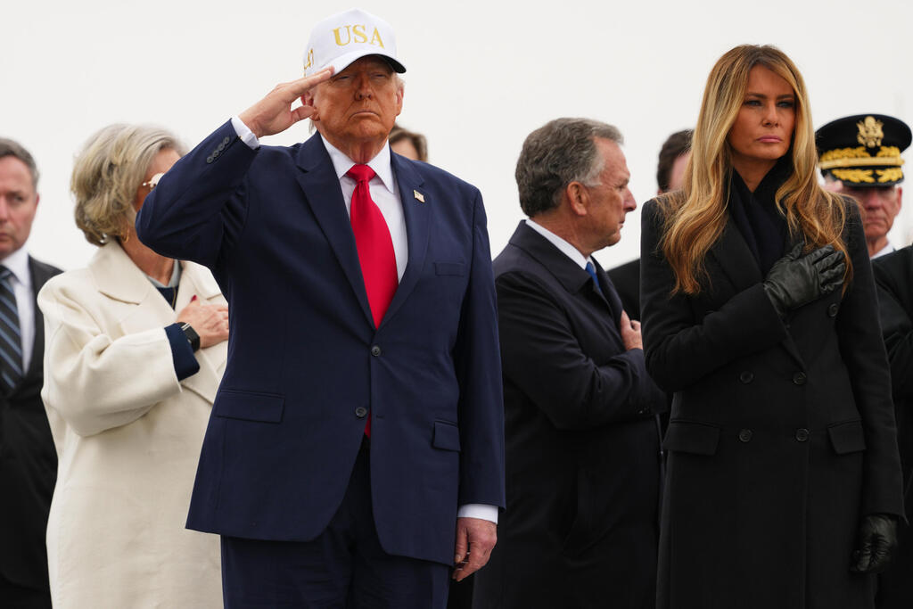 President Donald Trump and first lady Melania Trump attend a casualty return at Dover Air Force Base for the soldiers who were killed in a drone strike at a command center in Kuwait