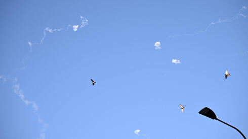 Lebanon rockets wound one, cause damage in central Israel; Iran missile falls in open area