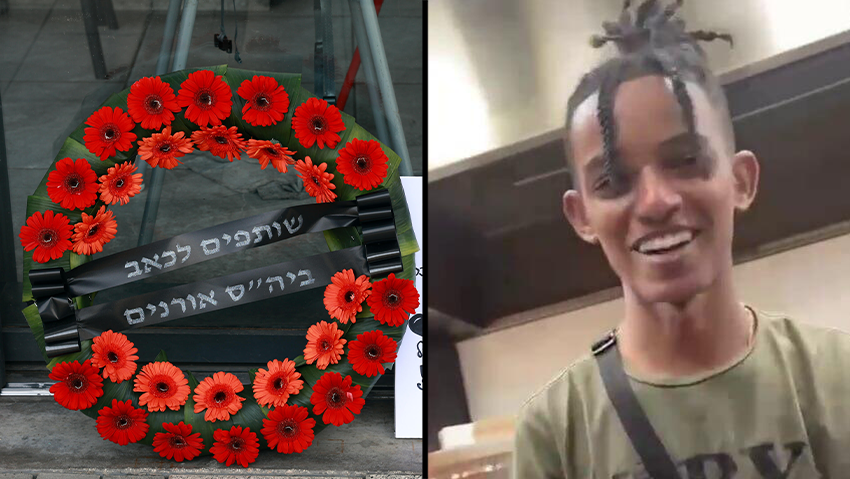 זלקה והפרחים שהונחו לזכרו מחוץ לפיצרייה שבה עבד (צילום: דנה קופל, שימוש לפי סעיף 27א' בחוק זכויות יוצרים) אנדרטה מחוץ לפיצרייה לימנו בנימין זלקה ז"ל