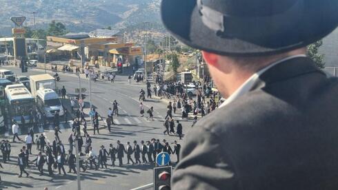 Anti-draft Haredi protesters smash Jerusalem police building doors, block...