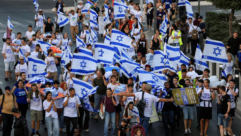 In Protest of Legislation Favoring Draft Evasion: Youth and Reserve Soldiers March to Knesset in Stretcher Procession