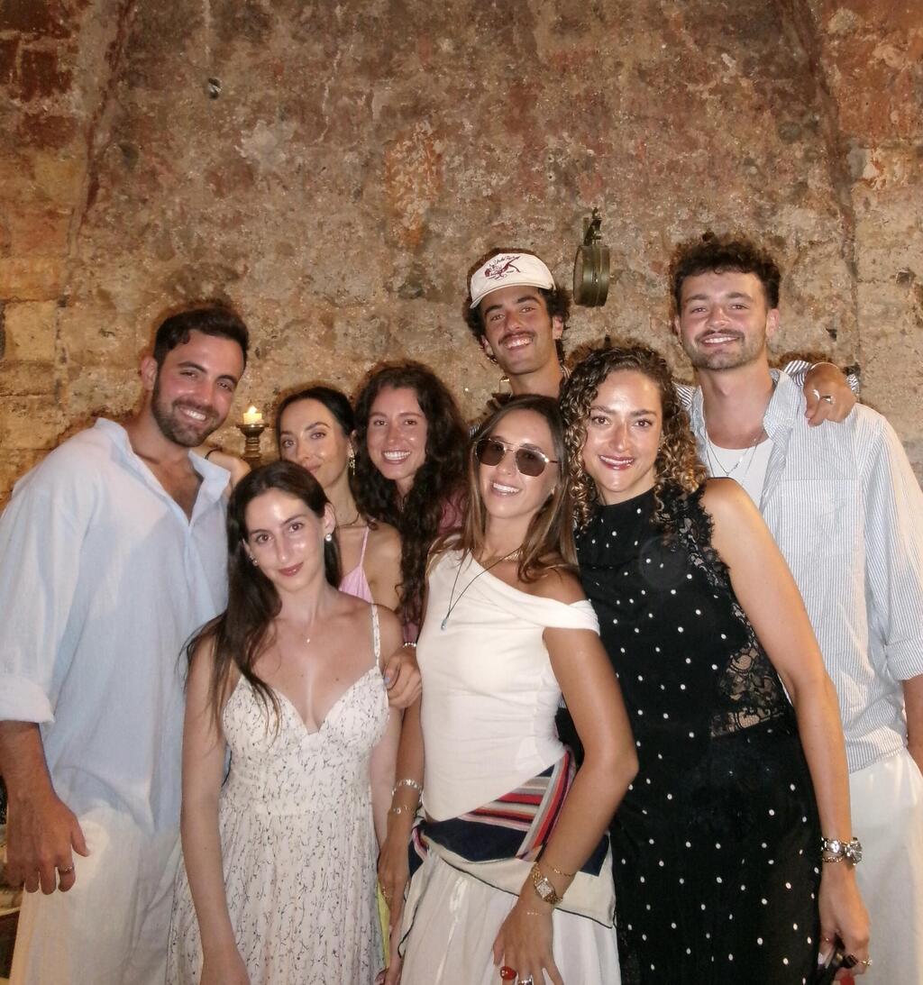 Joel, standing in the back row, joins fellow Storytellers participants for a group photo 
