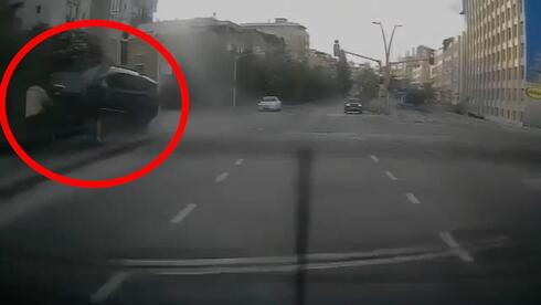 Car narrowly misses pedestrians before plunging from Tel Aviv bridge | Watch