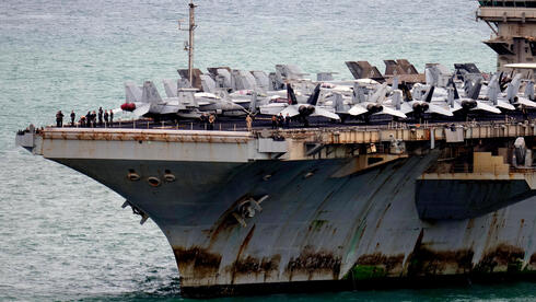 Iran tests Trump with Gulf strikes as US touts Hormuz oil surge and battered carrier raises alarms